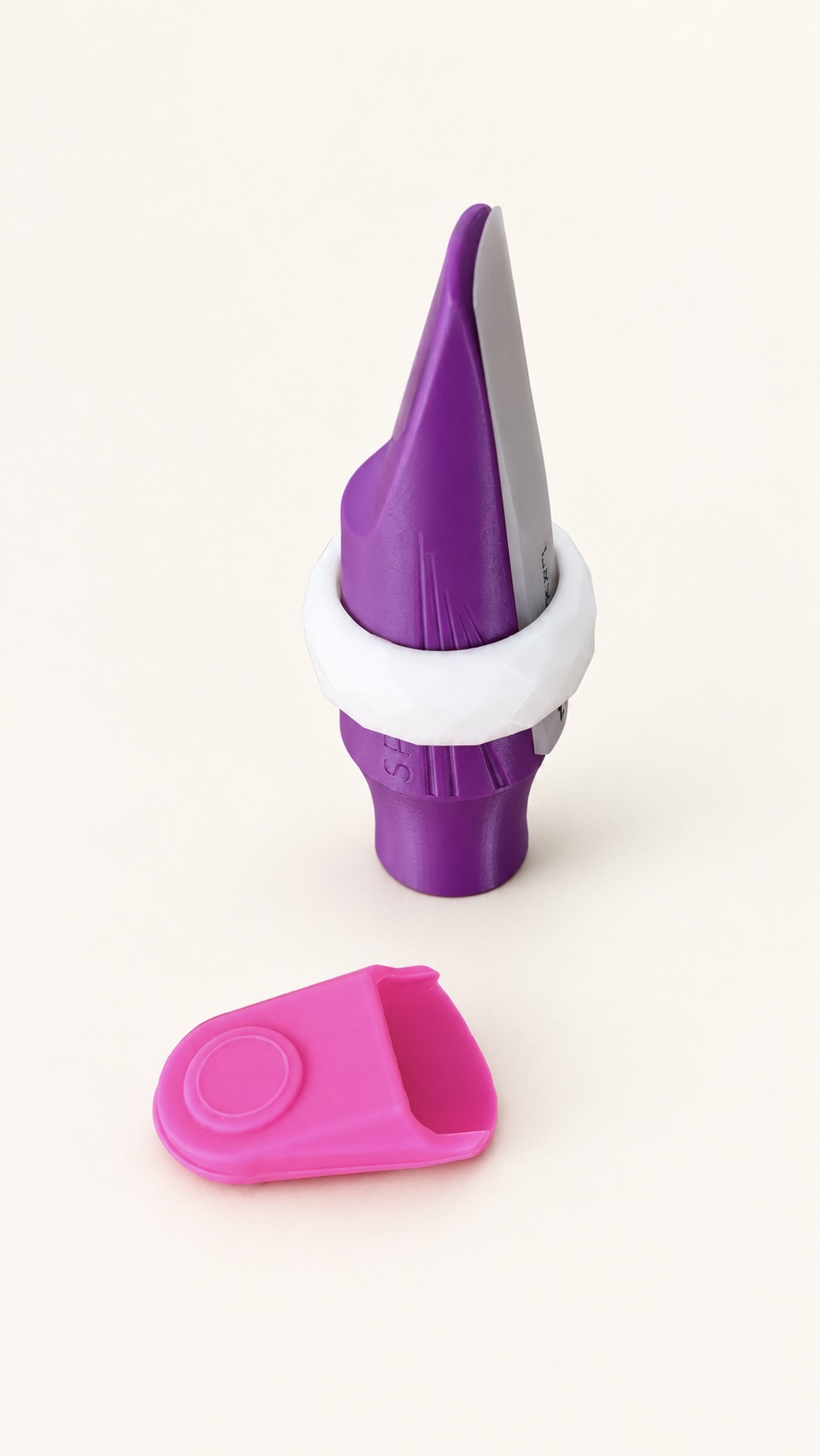 SAXELIER ligature fitted to a purple mouthpiece, with a reed cap shown beside it